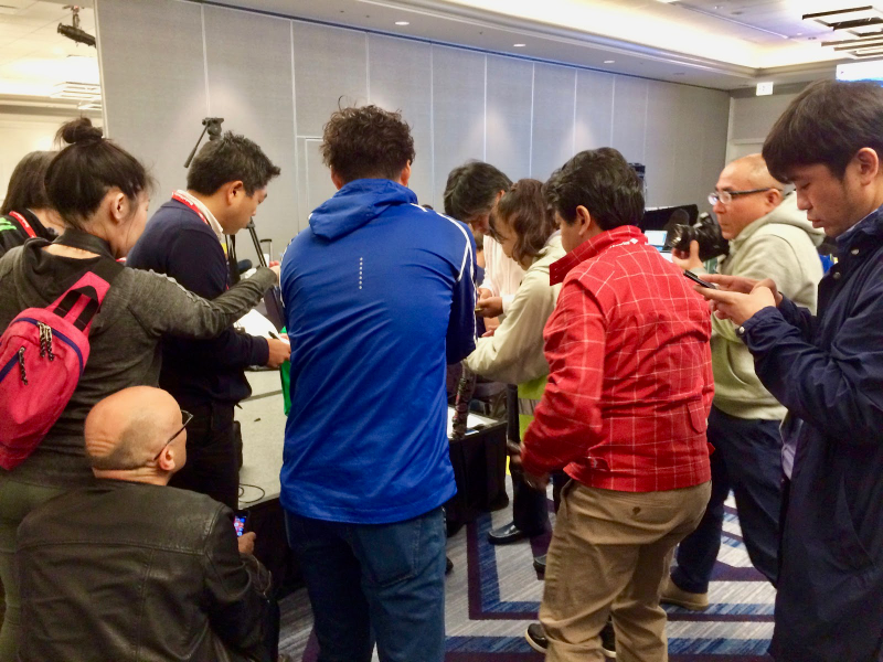Reporters crowd around Kawauchi